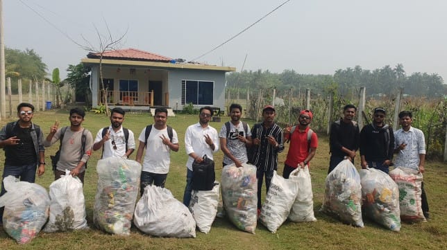 Group photo with collected trash